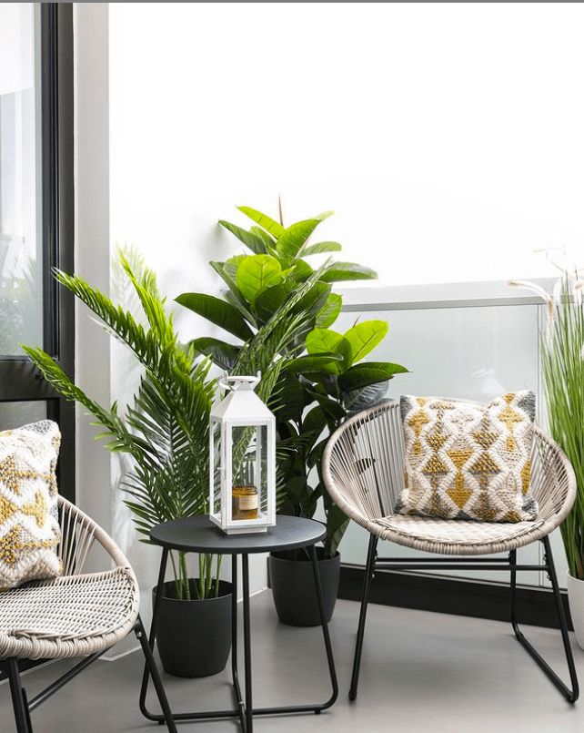 pair of acapulco chairs on balcony