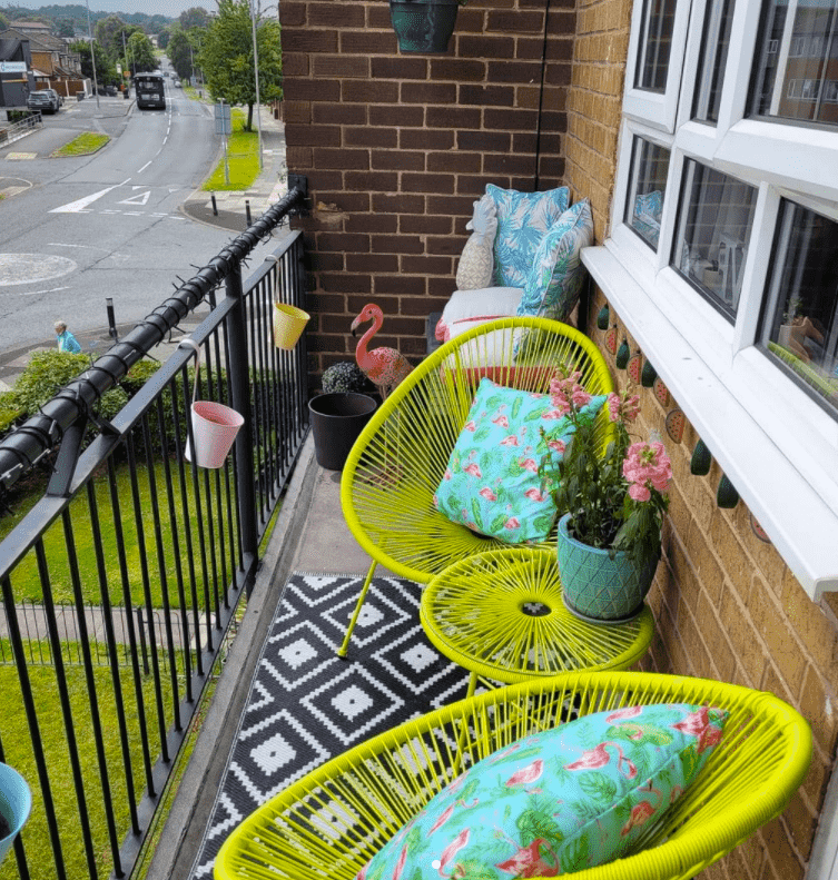 acapulco chairs on a balcony