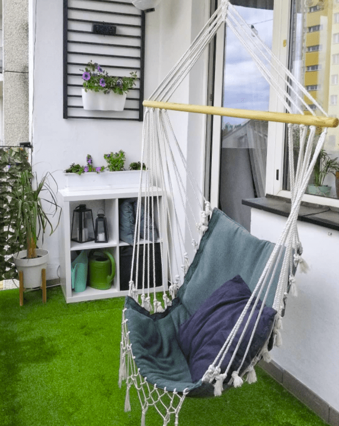 a hammock chair on a balcony