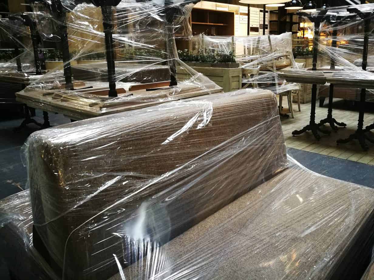 furniture wrapped in plastic