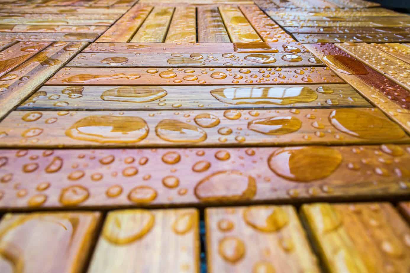 a wooden floor with water drops