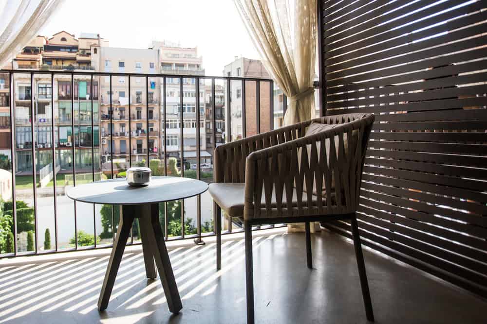 a balcony with curtains for privacy