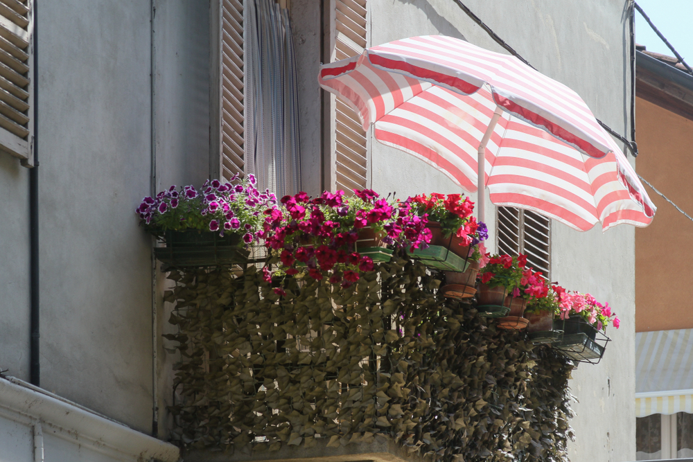 balcony being covered with an umbrella