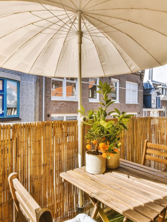 Narrow,Brick,Balcony,With,Metal,Railings,,Wooden,Chair,And,Door